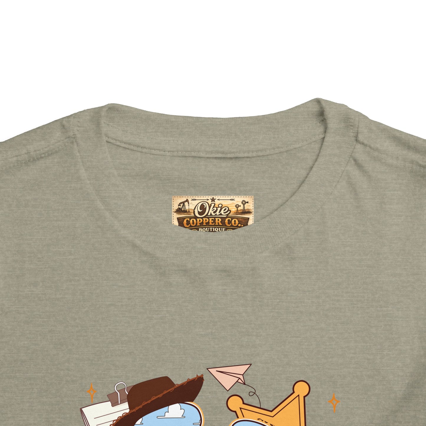 Toddler Tee — Cowboy Baby Western Collage | Sheriff Star, Boots & Wagon Wheel Graphic