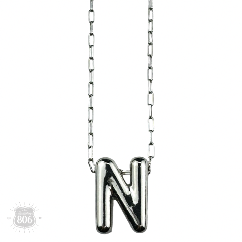 Silver letter pendant on necklace, initial monogram